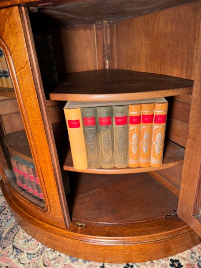 Pair of 19th century glass corner cabinets in blond oak