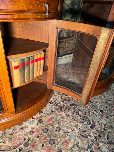 Pair of 19th century glass corner cabinets in blond oak