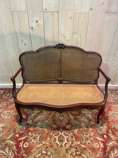 Louis XV mahogany and cane bench