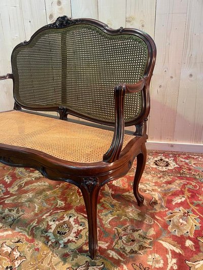 Louis XV mahogany and cane bench