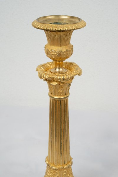 Pair of antique Empire ormolu candlesticks. 19th century.