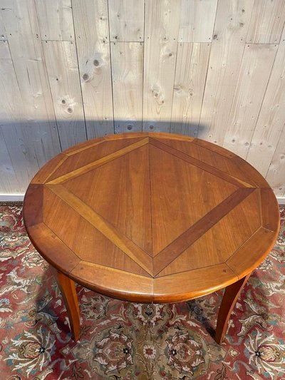 Round cherry wood dining table