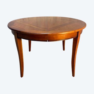 Round cherry wood dining table