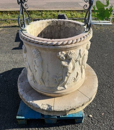 Reconstituted stone well with antique decorations circa 1950