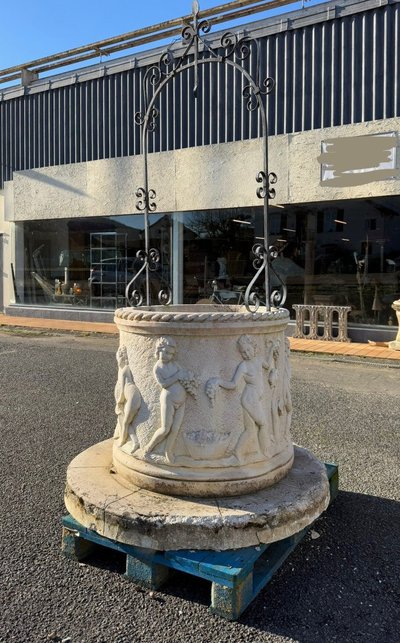 Reconstituted stone well with antique decorations circa 1950