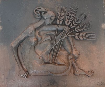 Modernist cast-iron plaque depicting a Nude Woman Holding a Scythe and Wheat Spikes.