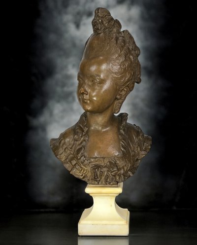 FERNAND CIAM 1886 - 1954 BUST OF A YOUNG WOMAN IN PATINATED TERRACOTTA ON A BASE