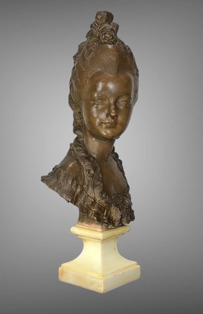 FERNAND CIAM 1886 - 1954 BUST OF A YOUNG WOMAN IN PATINATED TERRACOTTA ON A BASE