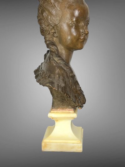 FERNAND CIAM 1886 - 1954 BUST OF A YOUNG WOMAN IN PATINATED TERRACOTTA ON A BASE