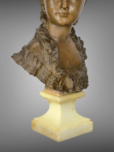 FERNAND CIAM 1886 - 1954 BUST OF A YOUNG WOMAN IN PATINATED TERRACOTTA ON A BASE