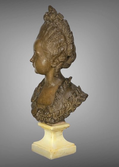 FERNAND CIAM 1886 - 1954 BUST OF A YOUNG WOMAN IN PATINATED TERRACOTTA ON A BASE