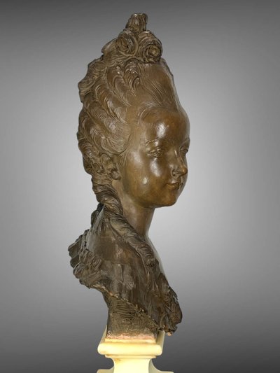 FERNAND CIAM 1886 - 1954 BUST OF A YOUNG WOMAN IN PATINATED TERRACOTTA ON A BASE