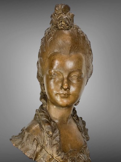 FERNAND CIAM 1886 - 1954 BUST OF A YOUNG WOMAN IN PATINATED TERRACOTTA ON A BASE