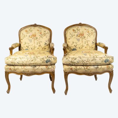 A pair of large Louis XV period moulded and carved natural beech armchairs circa 1750