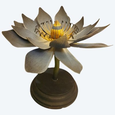 Painted metal water lily mounted on a wooden base