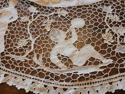 Embroidered pedestal tablecloth on the theme of grape harvests and wine, circa 1900