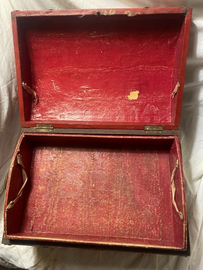 19th century red lacquered domed studded and strapped table box