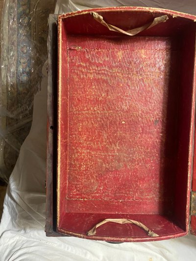 19th century red lacquered domed studded and strapped table box