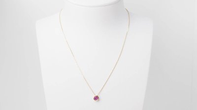 Yellow gold and ruby solitaire necklace