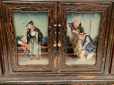 China, early 20th century, low enfilade buffet opening on four doors decorated with fixtures under glass