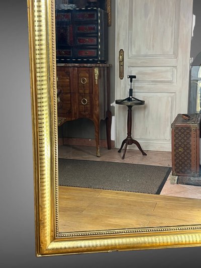 LARGE LOUIS PHILIPPE PERIOD MIRROR IN WOOD AND GILDED STUC (gilded leaf)