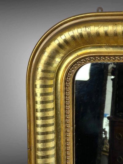 LARGE LOUIS PHILIPPE PERIOD MIRROR IN WOOD AND GILDED STUC (gilded leaf)