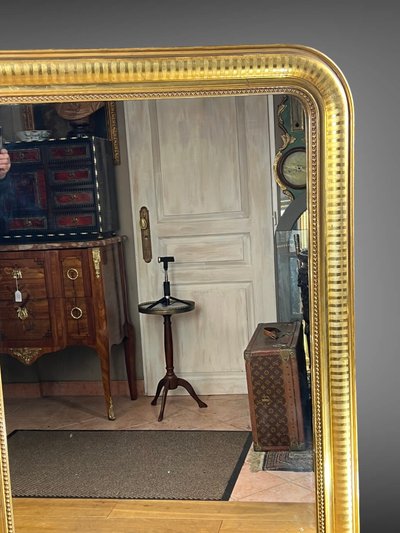 LARGE LOUIS PHILIPPE PERIOD MIRROR IN WOOD AND GILDED STUC (gilded leaf)