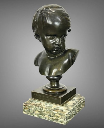 PATINATED BRONZE BUST OF A PUTTO AFTER FRANCOIS DUQUESNOY ON MARBLE BASE