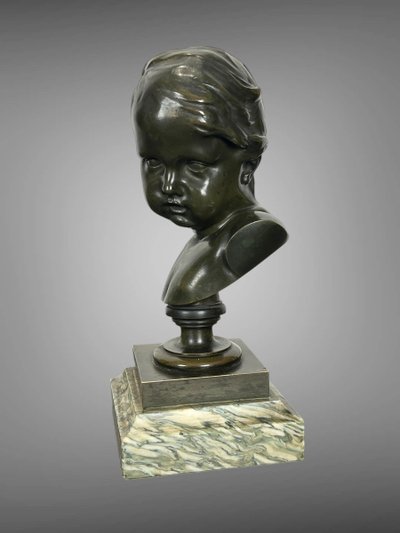 PATINATED BRONZE BUST OF A PUTTO AFTER FRANCOIS DUQUESNOY ON MARBLE BASE