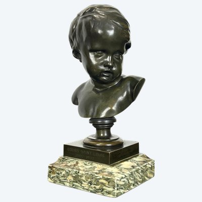 PATINATED BRONZE BUST OF A PUTTO AFTER FRANCOIS DUQUESNOY ON MARBLE BASE