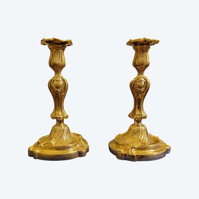 Pair of Rocaille Louis XV gilded chased bronze candlesticks 19th century