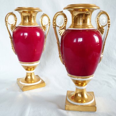 Pair of gilded and polychrome porcelain vases from Paris, Restoration period - 32,5cm