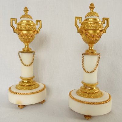 Pair of gilt bronze and marble cassolettes with upside-down candlesticks, Louis XVI style