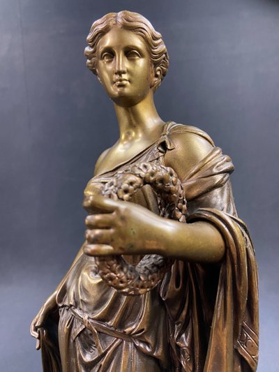 19th-century bronze sculpture of an antique woman with a foliage crown