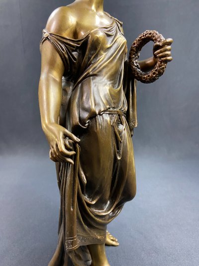 19th-century bronze sculpture of an antique woman with a foliage crown