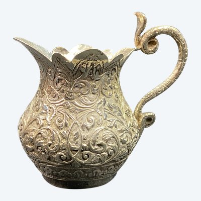 Milk jug in richly chased solid silver with Indo-Persian design and cobra handle