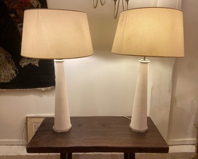 Pair of modernist stone and bronze lamps.