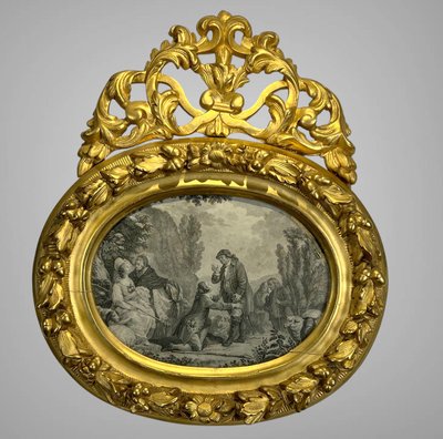 EIGHTEENTH CENTURY OVAL FRAME IN GILDED SCULPTTED WOOD AND ITS FURNACED FRONTIER