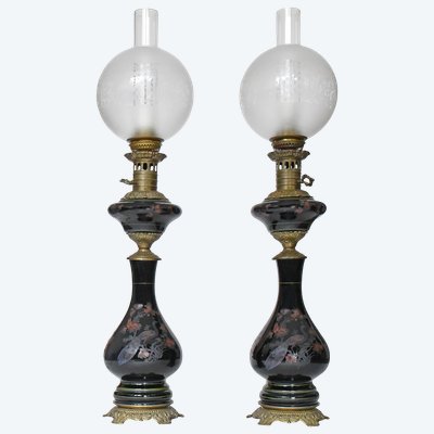 Pair of black opaline oil lamps with enamelled decoration of peacocks and flowers