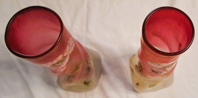 Pair of François Théodore Legras vases in enamelled twisted glass on a pink background with floral decoration, early 20th century