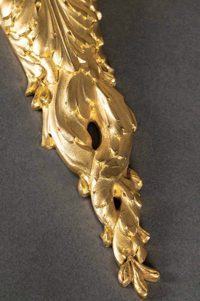 A pair of Louis XVI style Aux Termes de Femmes sconces in chiseled and gilt bronze circa 1850-1870