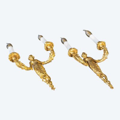 A pair of Louis XVI style Aux Termes de Femmes sconces in chiseled and gilt bronze circa 1850-1870