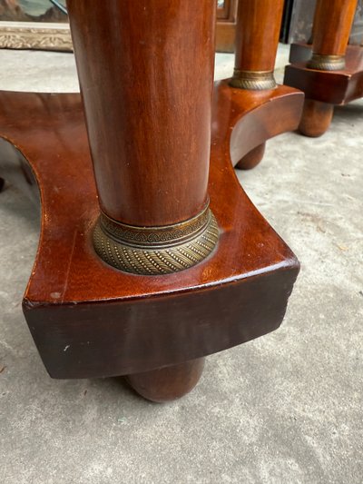 Pair of Empire style mahogany pedestal tables, veined marble top