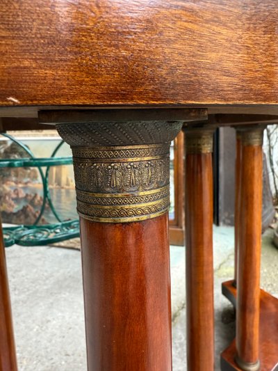 Pair of Empire style mahogany pedestal tables, veined marble top