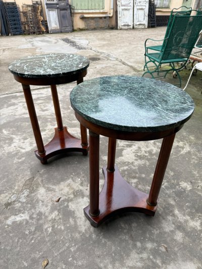 Pair of Empire style mahogany pedestal tables, veined marble top