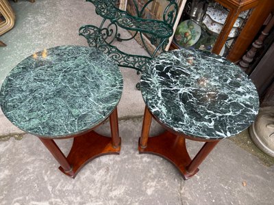 Pair of Empire style mahogany pedestal tables, veined marble top