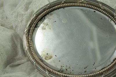 Small oval beveled mirror with solid silver frame circa 1900