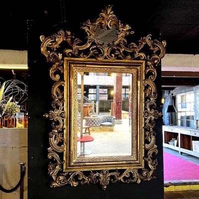 Louis XV Rocaille Style Gilded Wood and Stucco Mirror