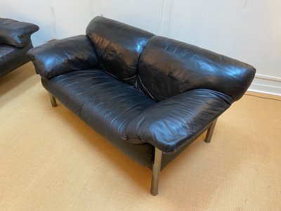 Pair of black leather sofas produced by Poltrona Frau, circa 1980/1990.