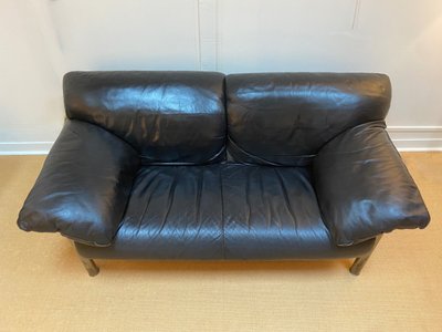 Pair of black leather sofas produced by Poltrona Frau, circa 1980/1990.